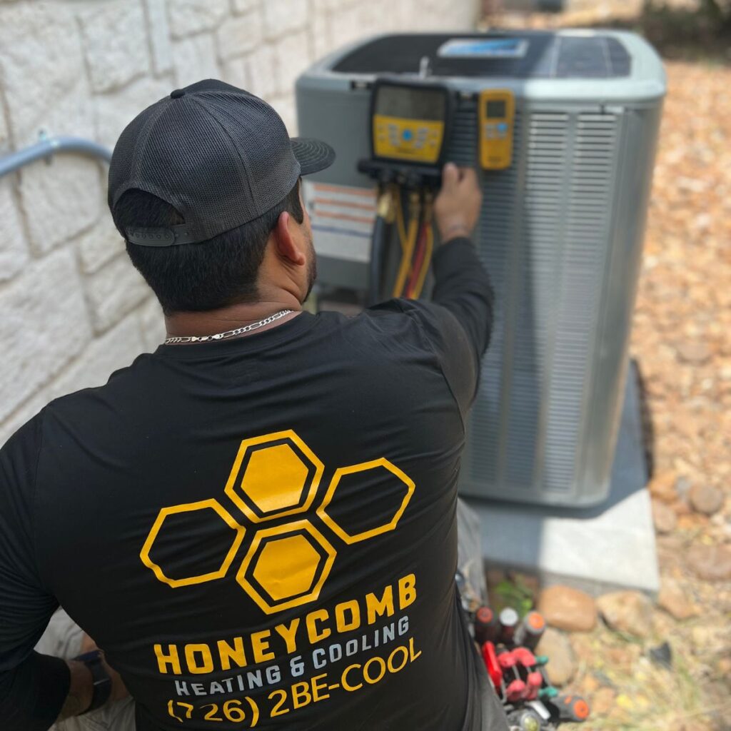 HVAC technician performing ac maintenance on air conditioner in san antonio, tx