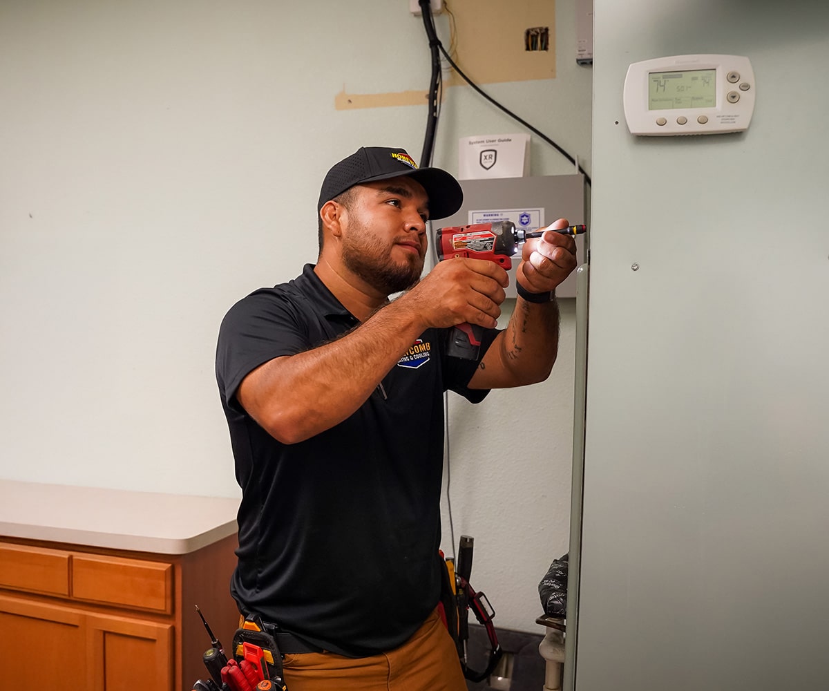 Honeycomb technician installing furnace