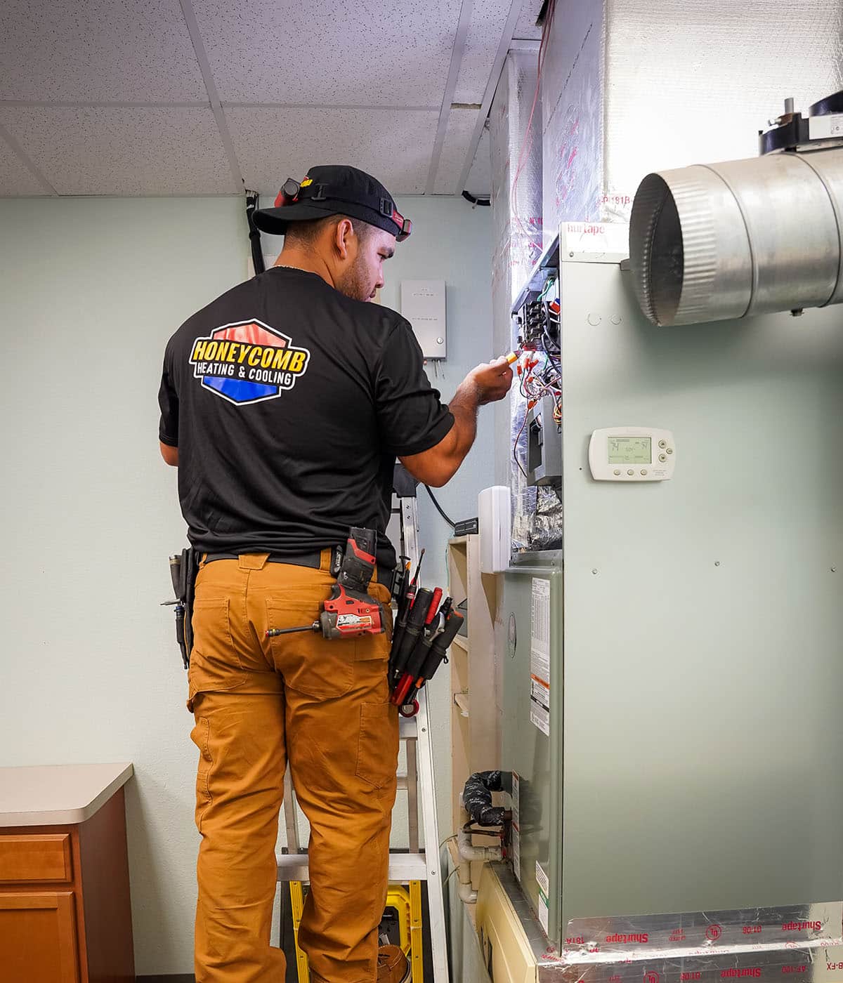 Honeycomb technician working on a furnace