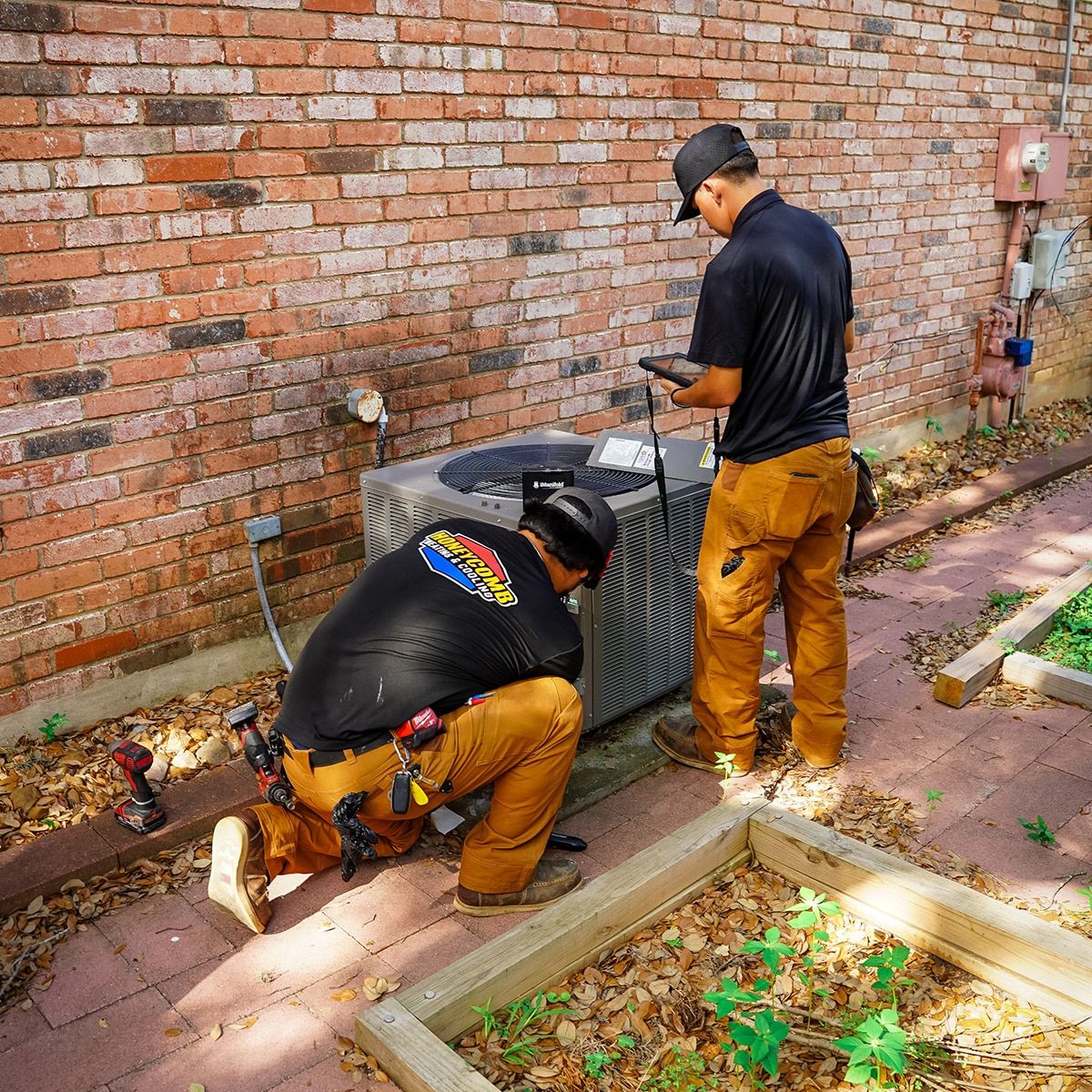This image shows a skilled technician carefully installing an HVAC system, representing accessible financing options for homeowners
