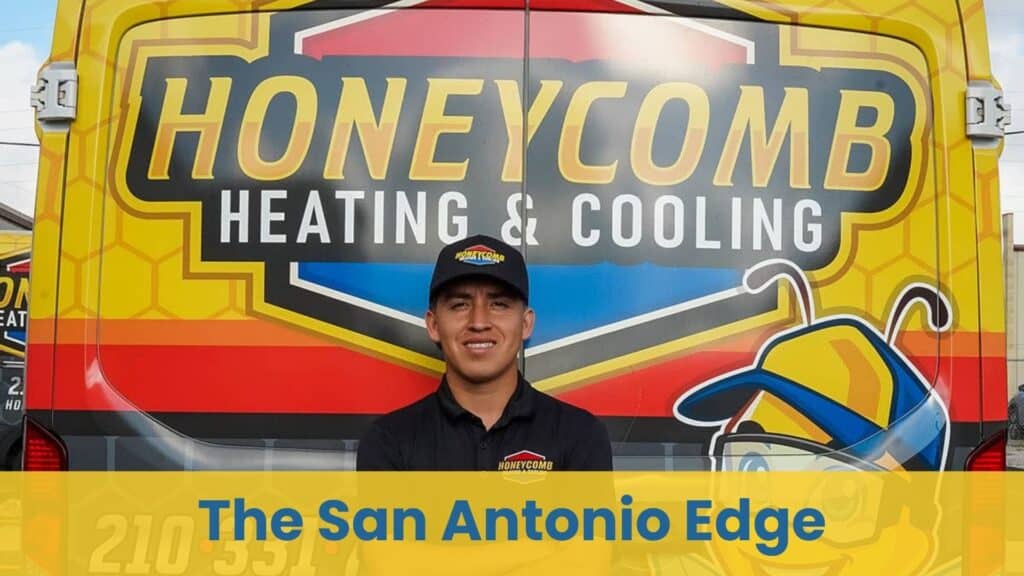A smiling HVAC technician in front of a Honeycomb Heating and Cooling van providing expert air conditioning maintenance.