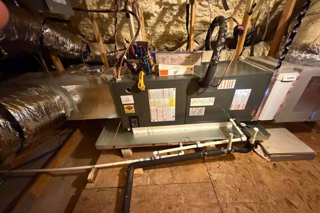 Honeycomb Heating & Cooling technician performing heater maintenance in a Leon Valley home.
