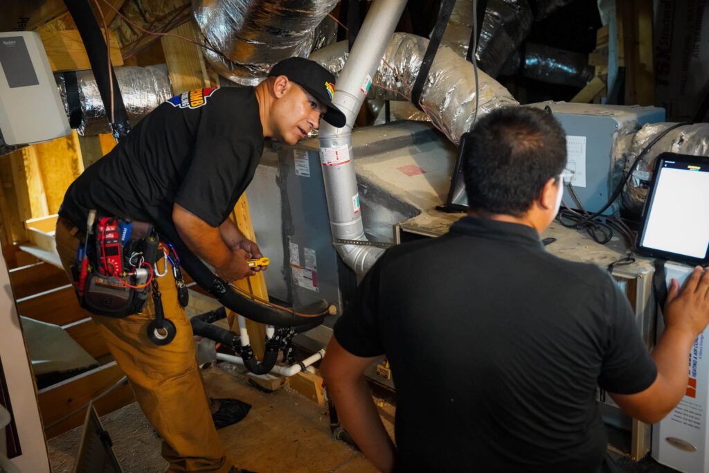 Expert technician completing a heating system safety check and heater maintenance in Live Oak, TX.