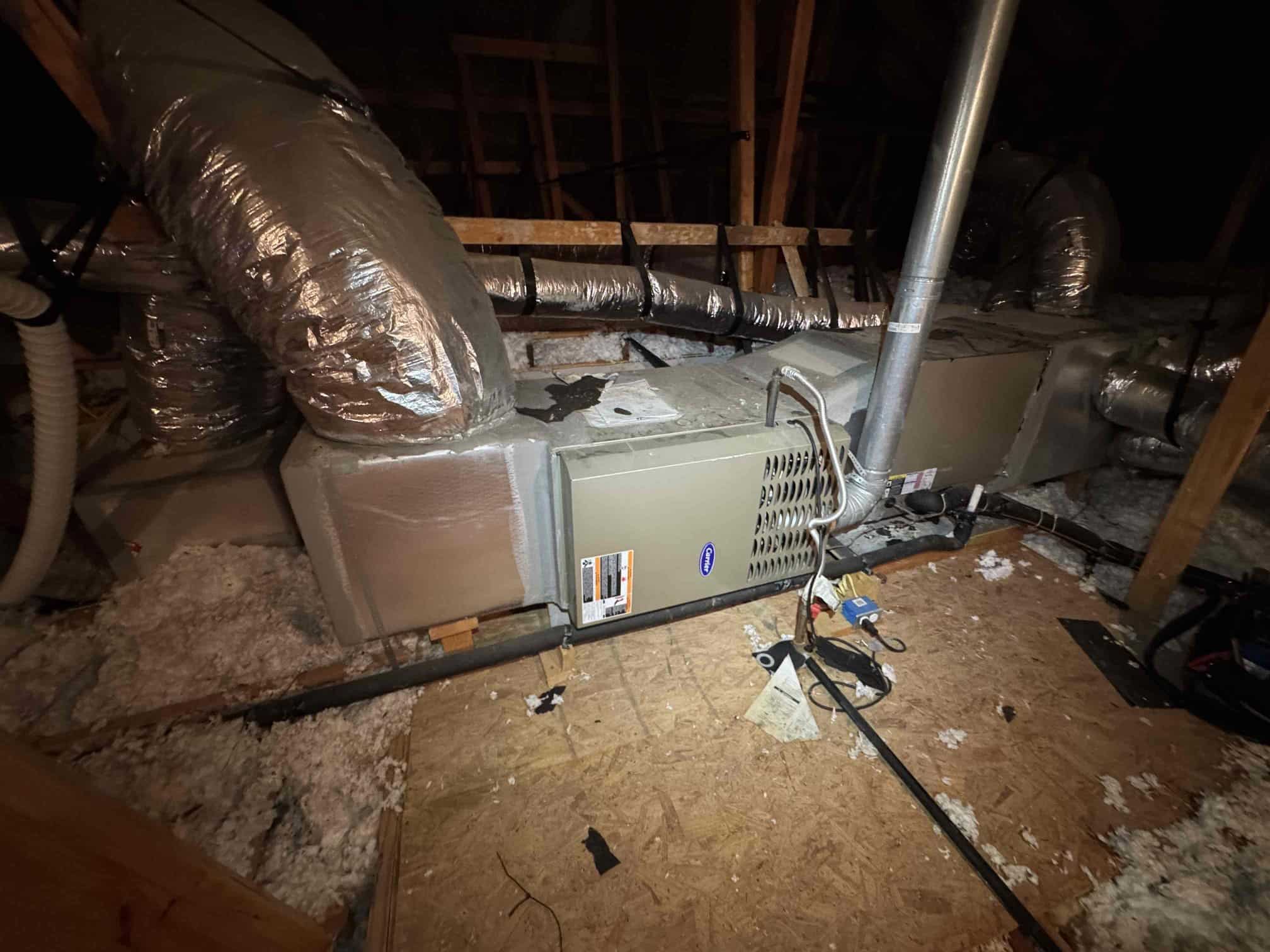 Before: the old attic furnace being replaced