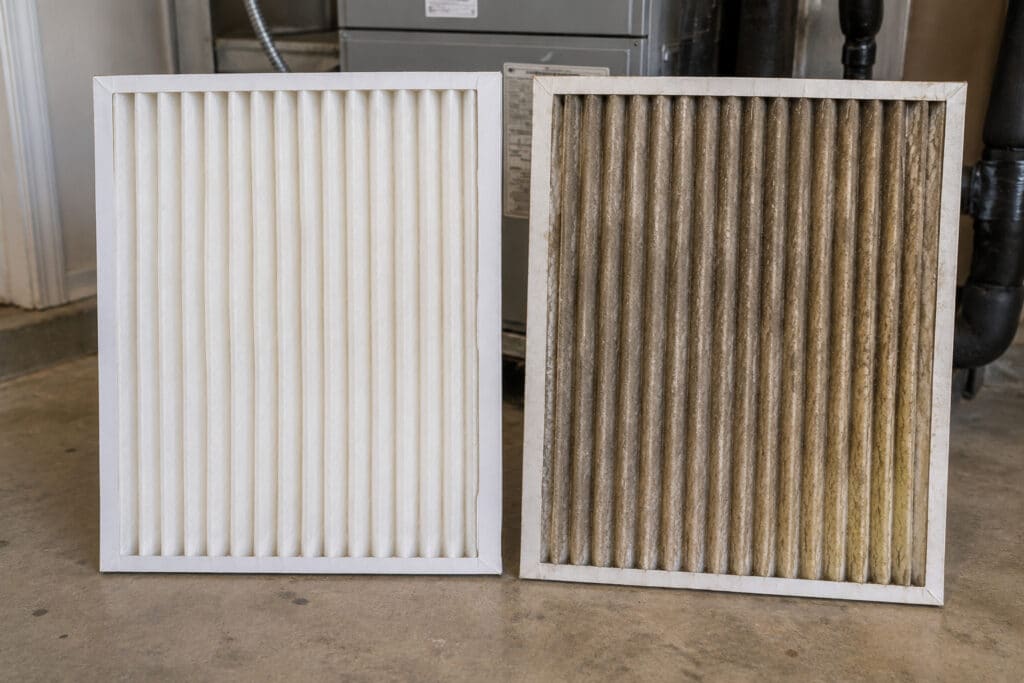 Dirty Air Filters & AC Running But Not Cooling Bulverde | Honeycomb Side-by-side comparison of a clean white HVAC air filter and a dirty filter causing an AC running but not cooling in Bulverde homes, by Honeycomb.